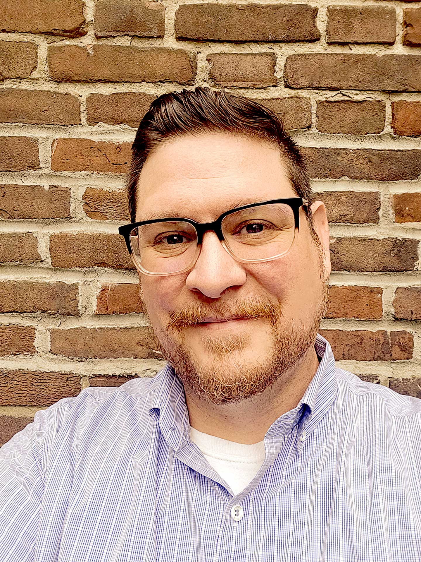 A headshot of Mark Young